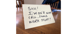 Table tent that says "Shh! I'm on a work call, doing work stuff!"